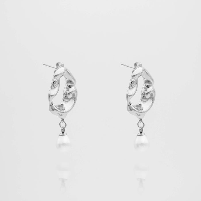 Silver earrings with pearl drops, abstract design.