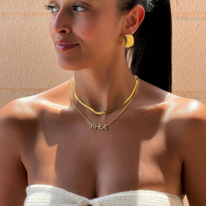 model wearing icy classic custom name necklace in gold from prya