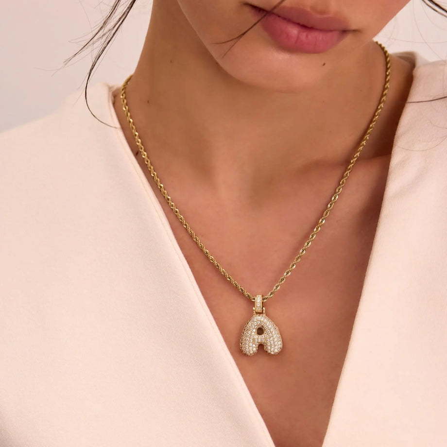 model wearing gold pave bubble initial necklace with the rope chain from prya