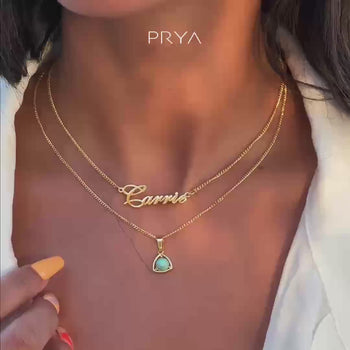 Video of Model wearing waterproof Siena Personalised name necklace in gold by PRYA Jewellery UK