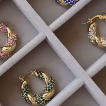 video of gia twisted hoop earrings from prya in emerald, pave, blue and pink
