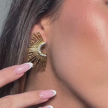 video of model wearing gold statement earring with cz stones inspired my sun rays from prya