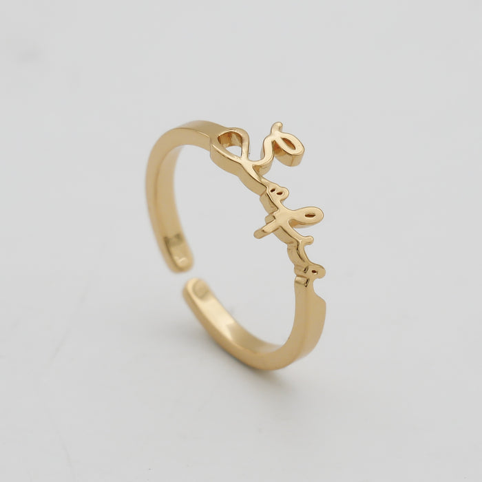 Gold ring with custom name design.