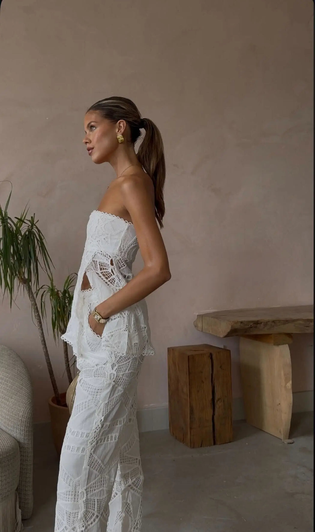 image of model wearing white lace and gold square statement earrings from prya