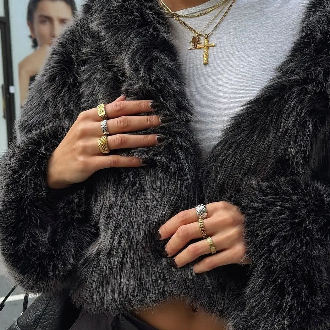 image of model wearing ring stacks and layered gold necklaces from prya