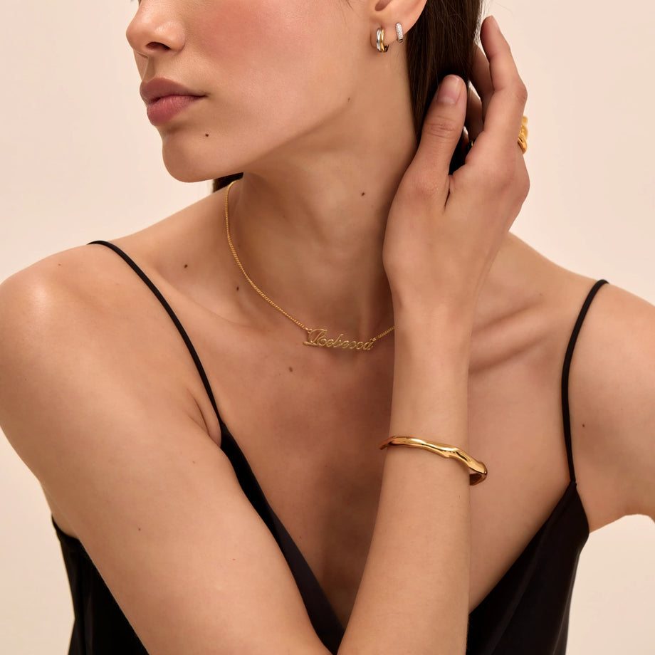 model wearing gold ring and bracelet stacks and bangles from prya