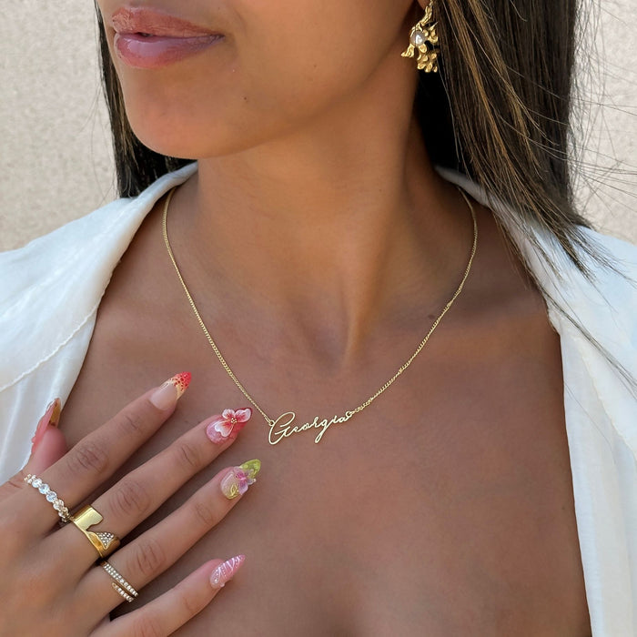 model wearing 18k gold plated valencia personalised name necklace from prya