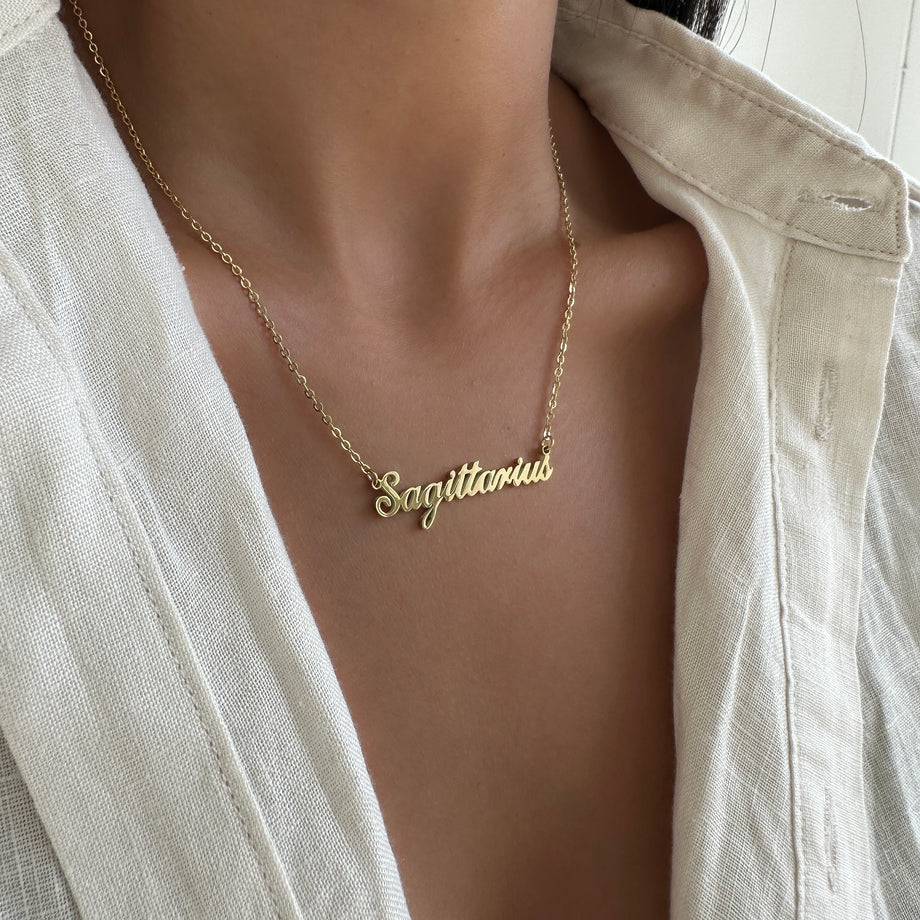 zodiac name necklace available in 18k gold plated or silver plated stainless steel from prya