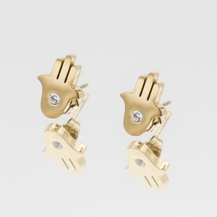 Gold Hamsa earrings with diamond centres.