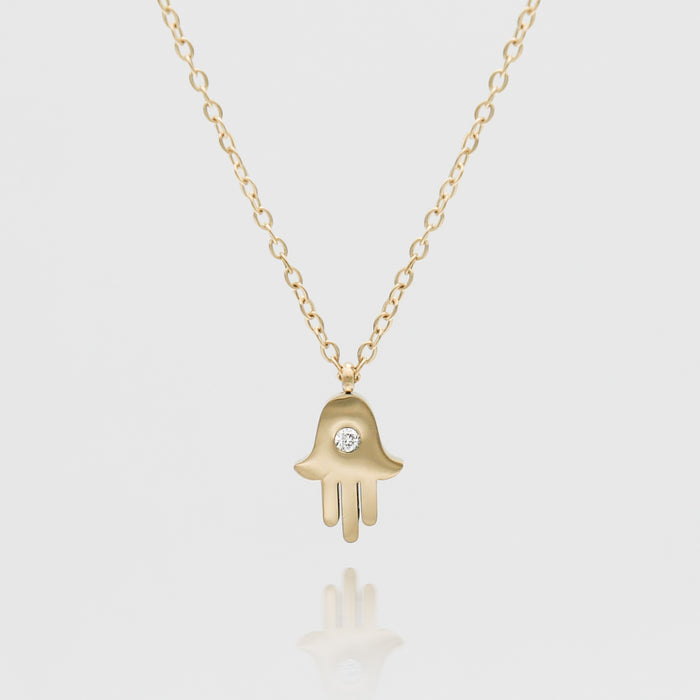 Amalie Hand of Hamsa gold necklace.