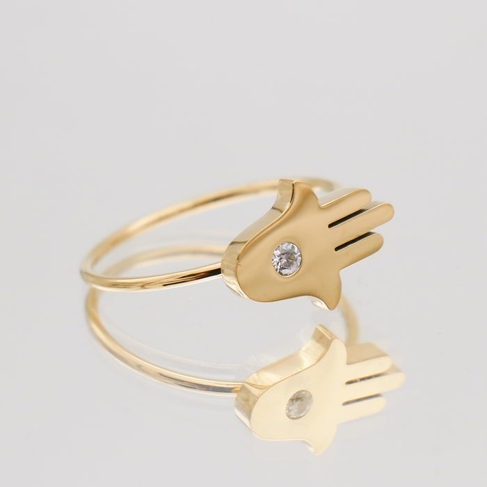 Gold ring with Hamsa hand design.