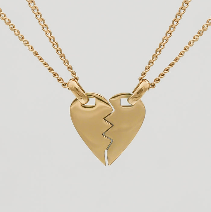 Gold split heart necklace with double chains.