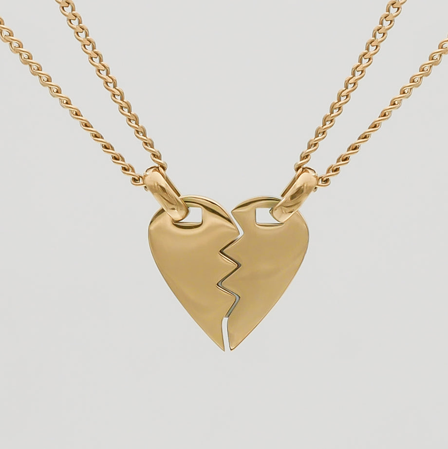 Gold split heart necklace with double chains.