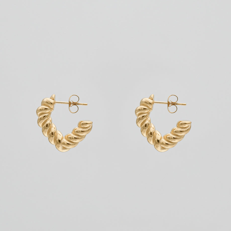 cara twisted half hoop earrings in gold