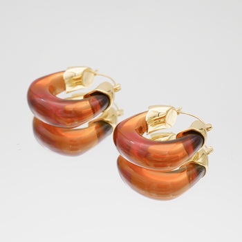 Amber Celine lucite hoop with an oval shape