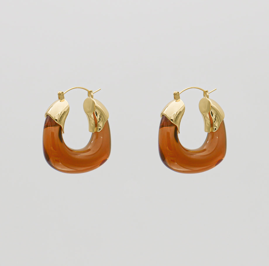 Amber Celine lucite hoop with an oval shape