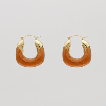 Amber Celine lucite hoop with an oval shape