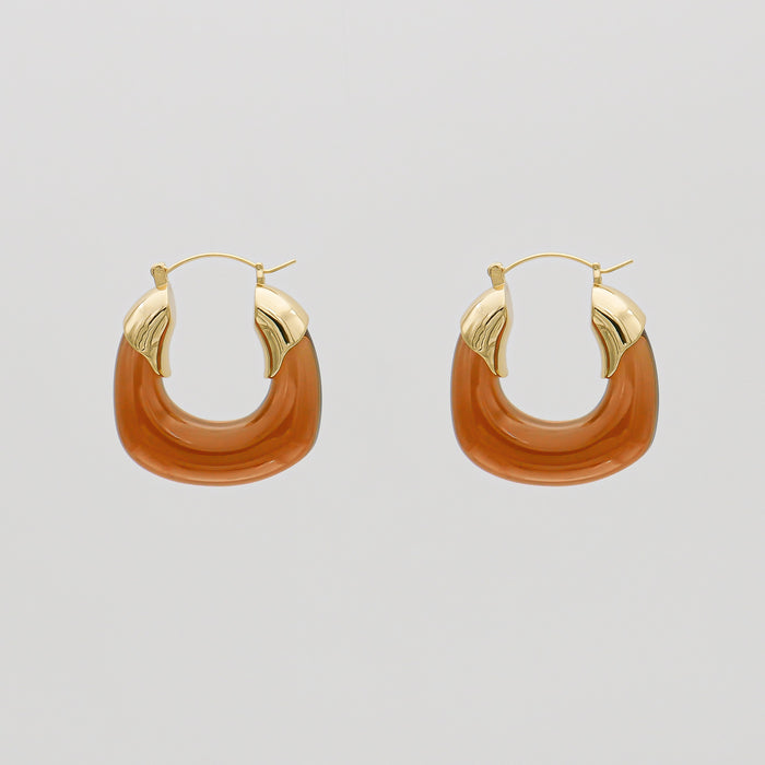 Amber Celine lucite hoop with an oval shape