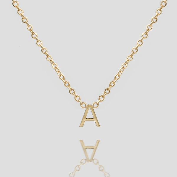 Mini initial necklace in gold
