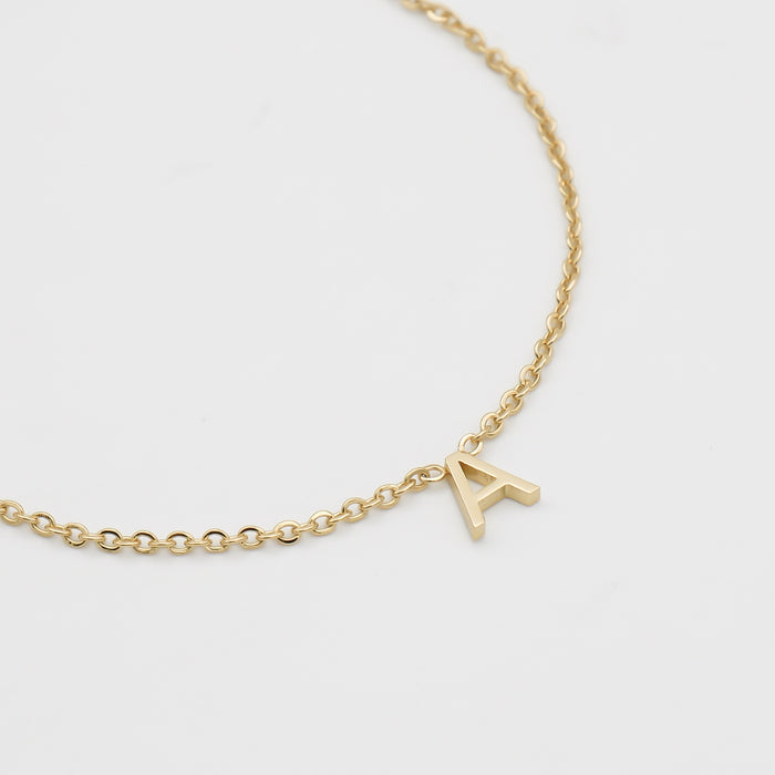 Mini initial necklace in gold