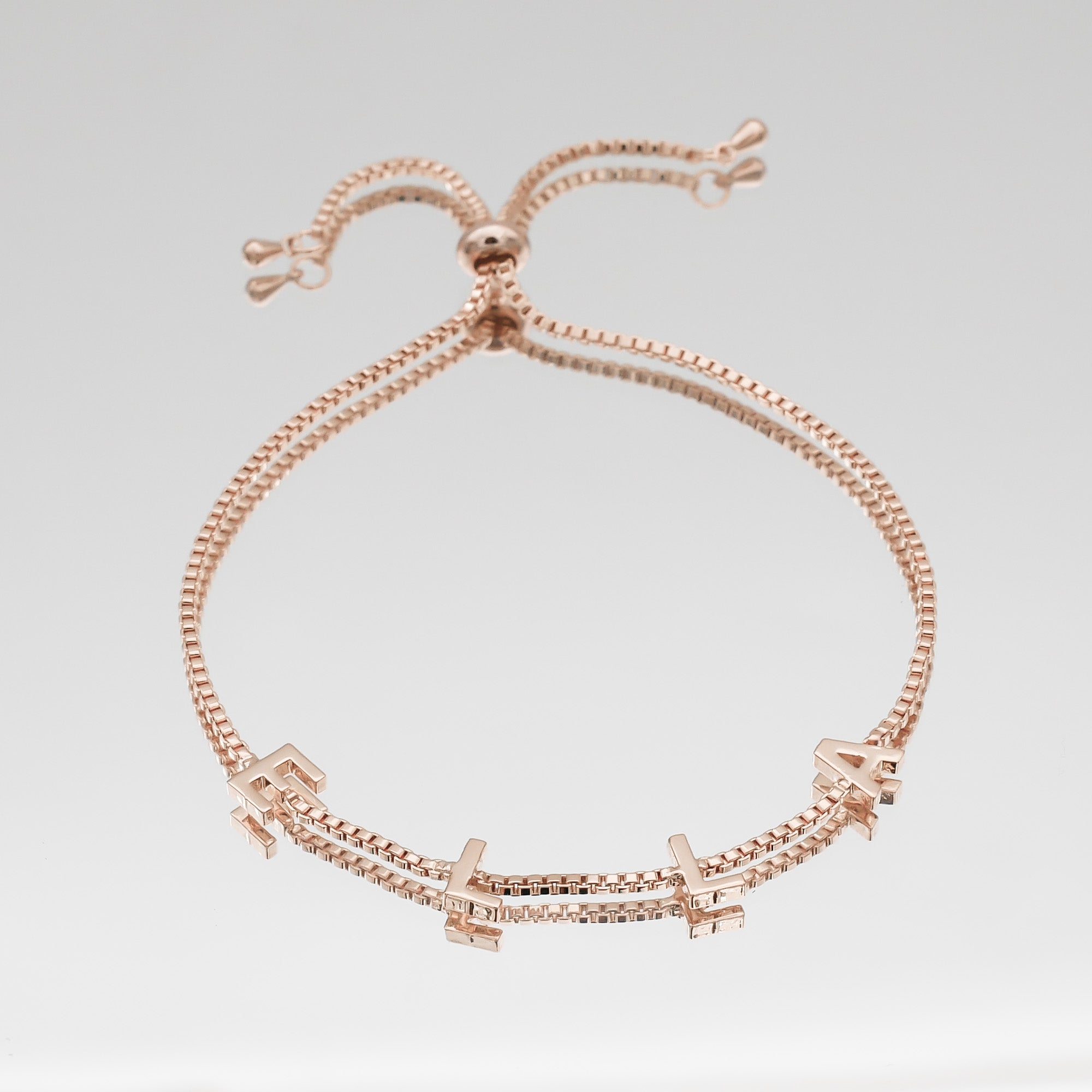Classic personalised name bracelet in 14K rose gold with charm