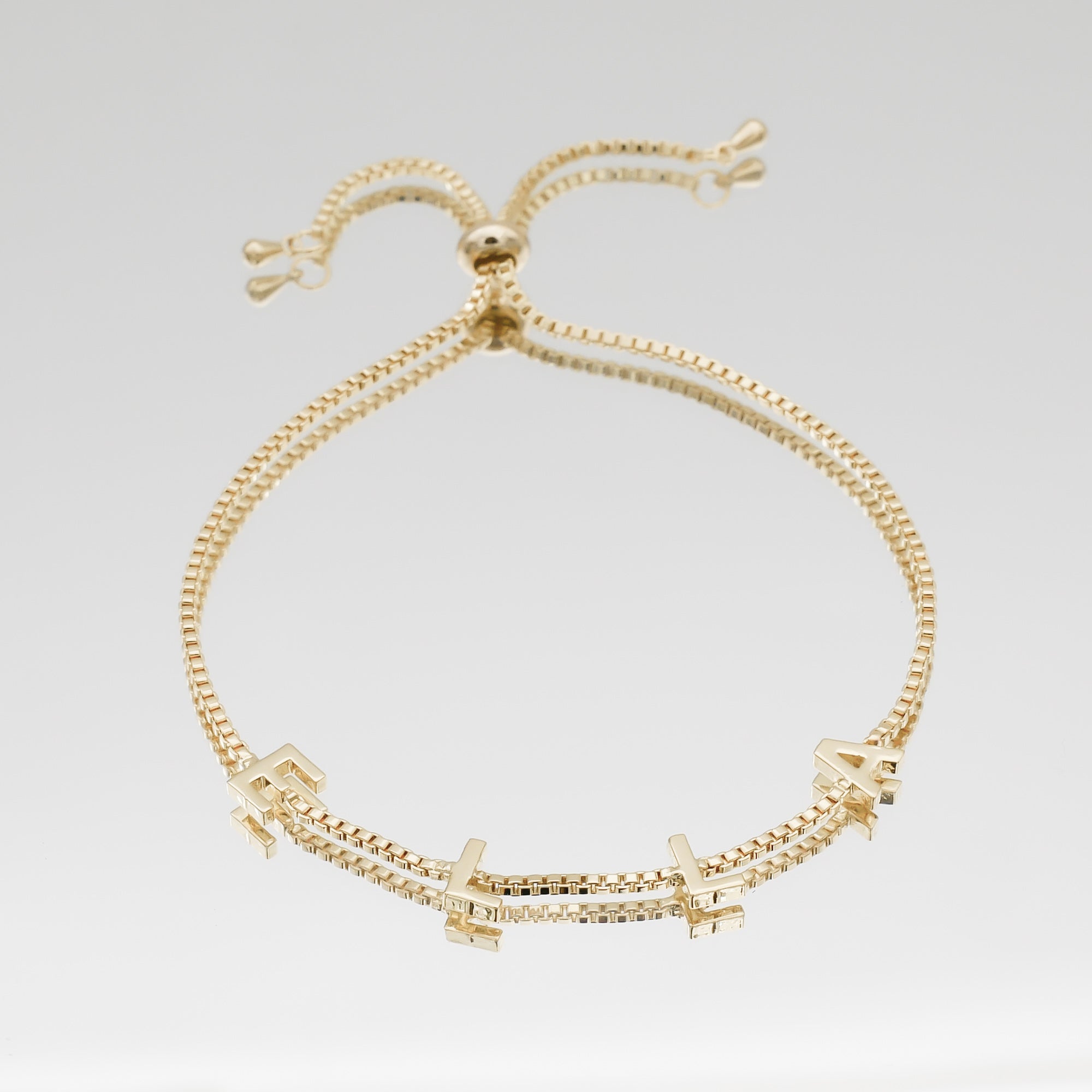 Classic personalised name bracelet in 18K gold with charm