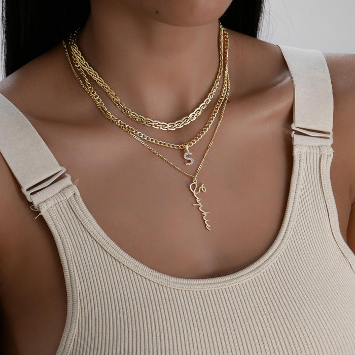 model wearing ICY Initial Necklace Cuban, available in Gold or Silver Plated, A-Z initials from Prya