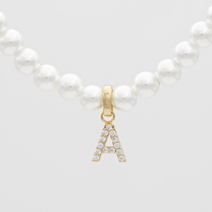 Pearl necklace with gold 'A' pendant.