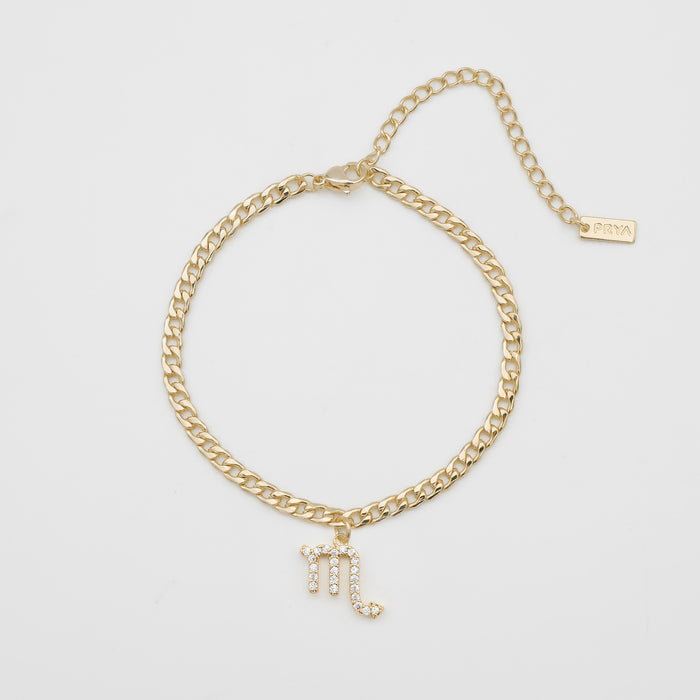 Gold anklet with Scorpio charm.
