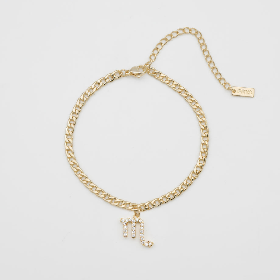 Gold anklet with Scorpio charm.