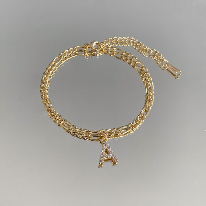 icy Initial Anklet in gold on figaro chain from PRYA Jewellery UK