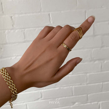 Model wearing 3 stand chevron ring in gold