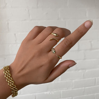 model wearing Gold snake ring with CZ eyes