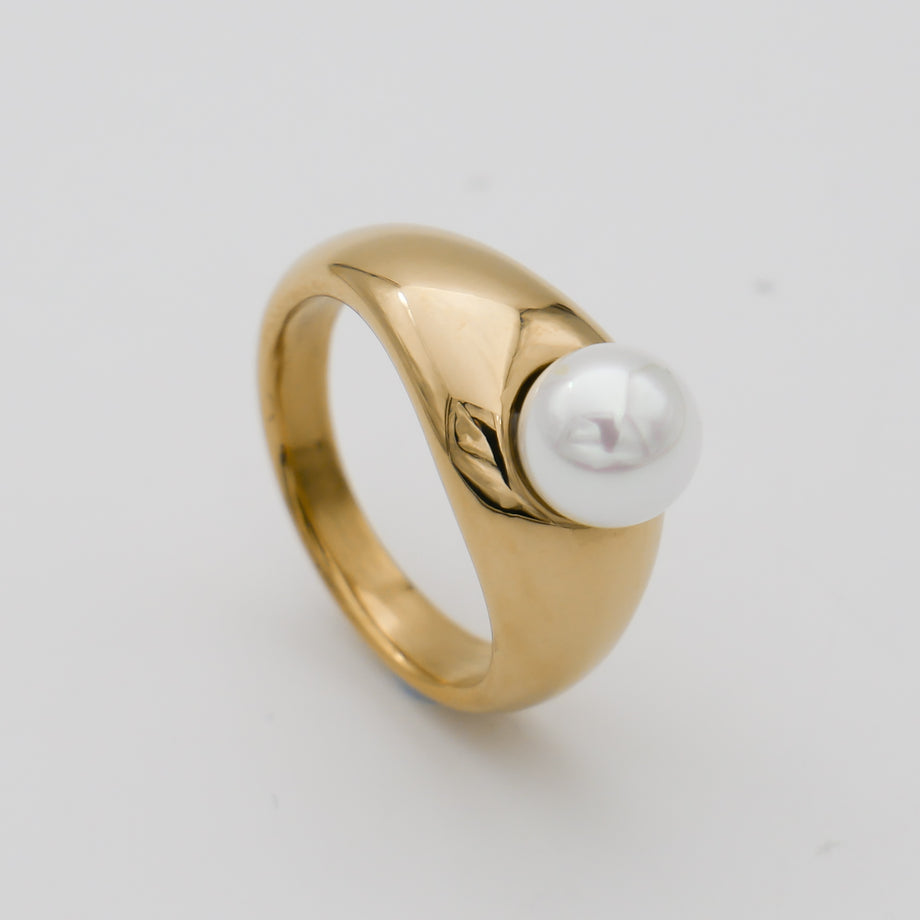 Gold ring with a single pearl.