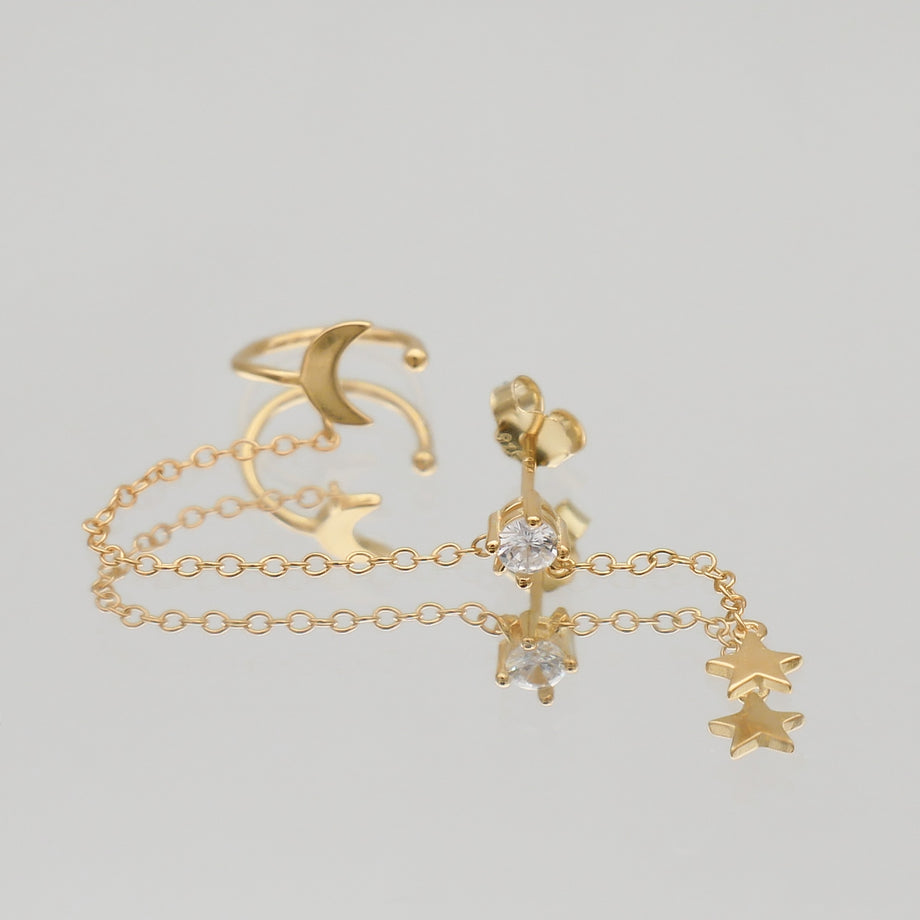 Gold moon and star chain earrings.
