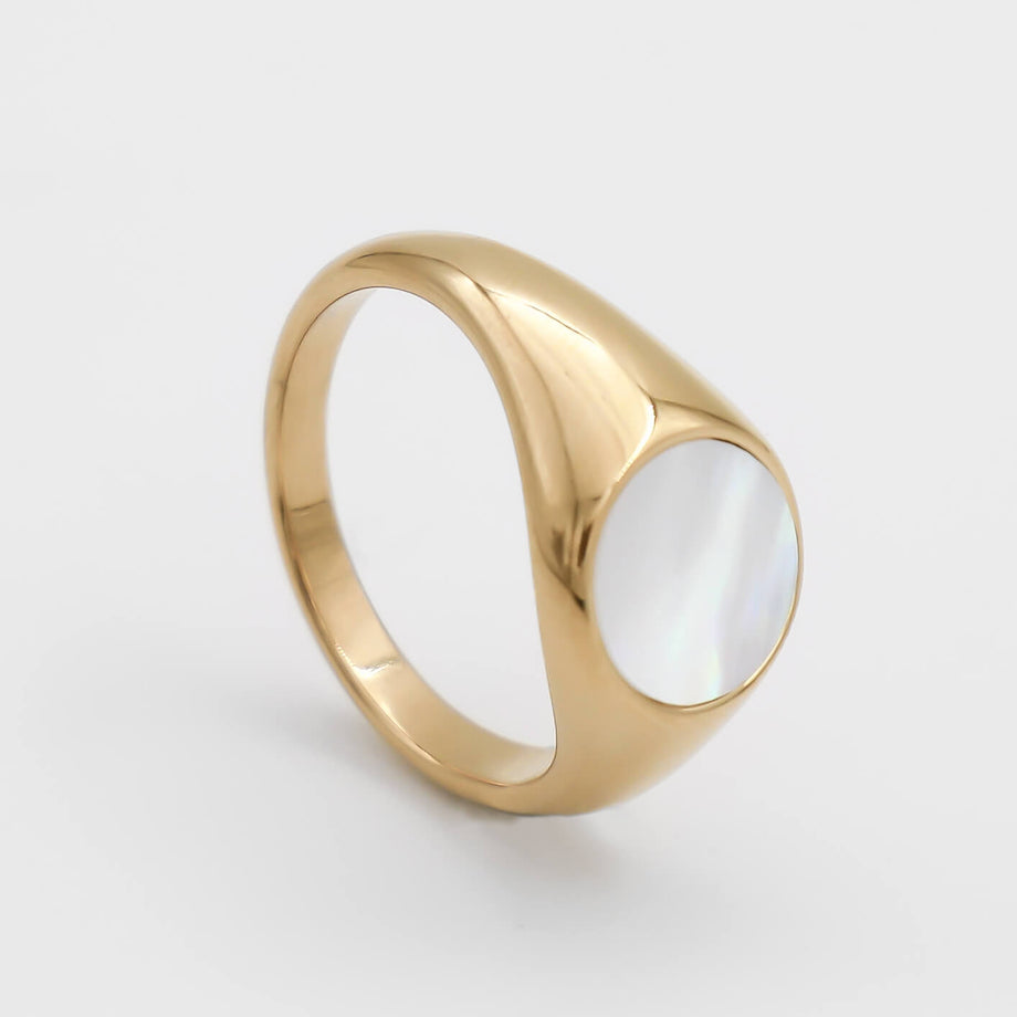 Gold ring with an opal inlay.