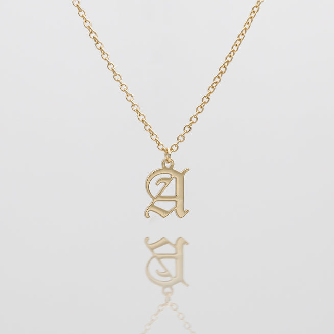 Gold necklace with Old English letter "A".