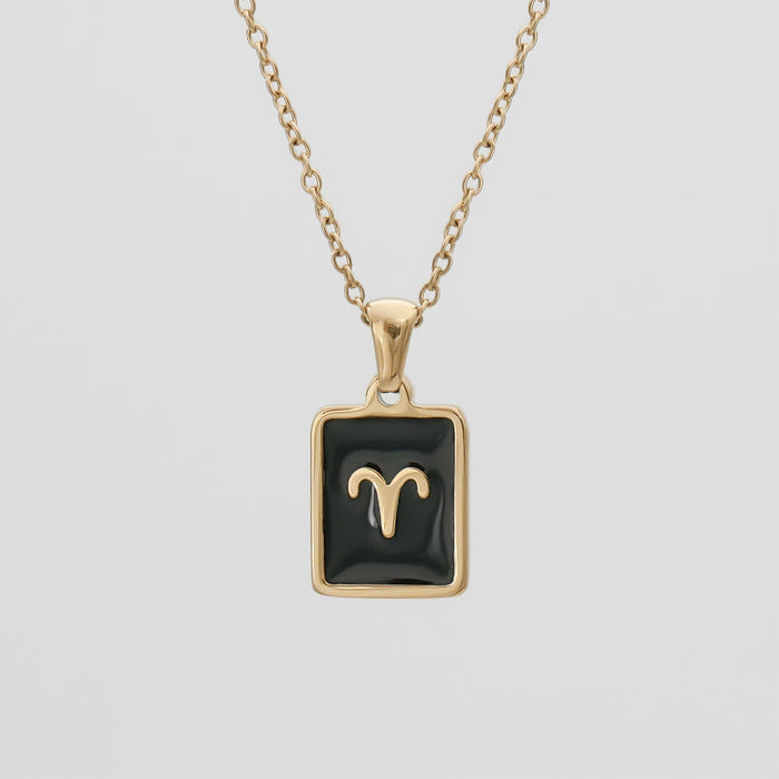 Gold Aries pendant necklace on a chain.