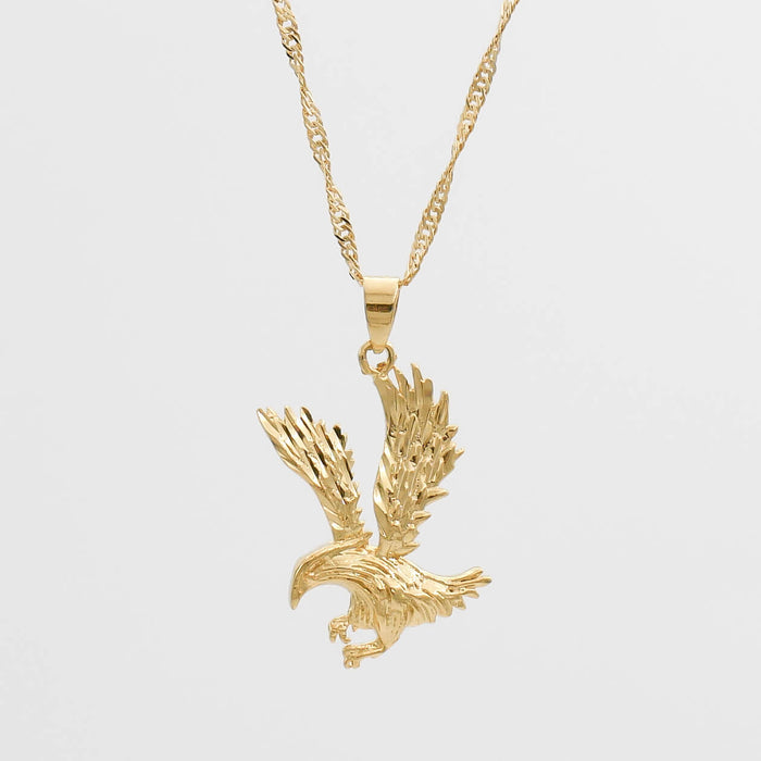 Gold eagle pendant on a twisted chain.