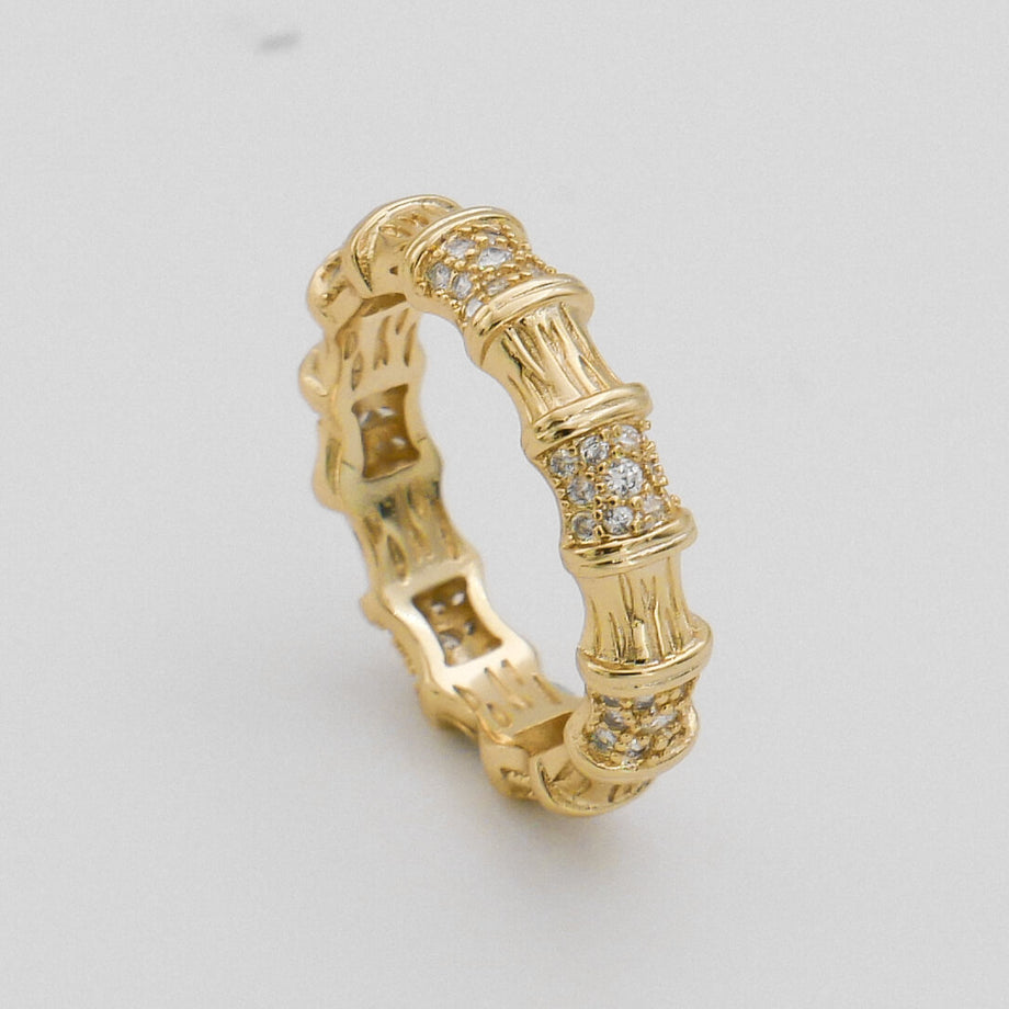 Gold ring with bamboo design and diamonds.