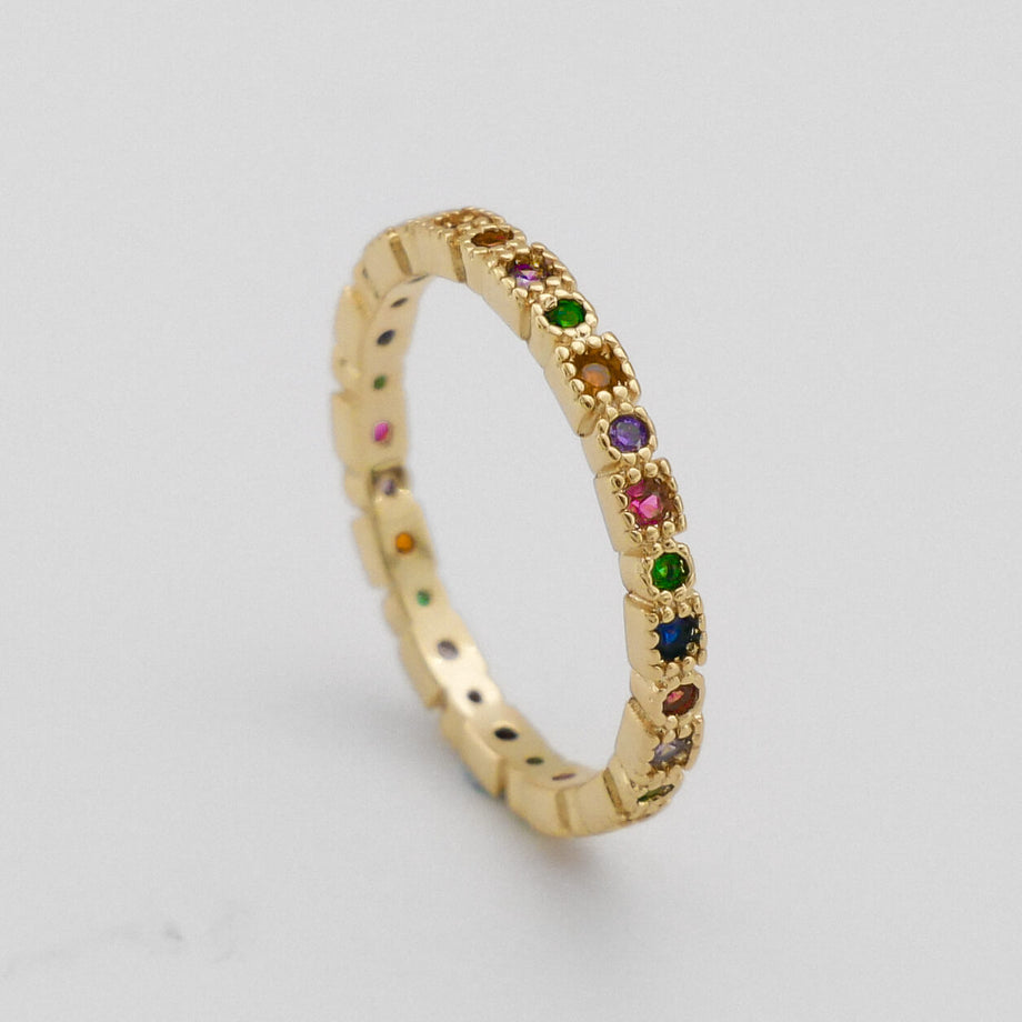 Gold ring with colourful gemstones.