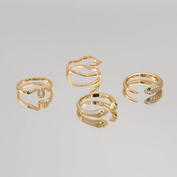 Selection of gold snake rings from PRYA