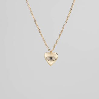 Gold Heart Pendant with a paved CZ Evil Eye.