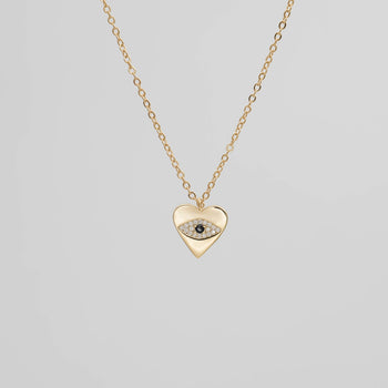 Gold Heart Pendant with a paved CZ Evil Eye.