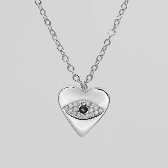 close up of silver Heart Pendant with a paved CZ Evil Eye.