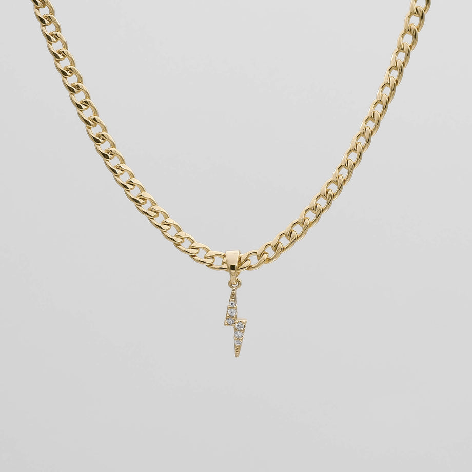 Gold chain with lightning bolt pendant.