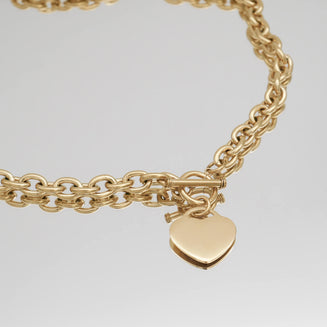 close up of hayley heart t bar necklace in 18k gold plated from prya