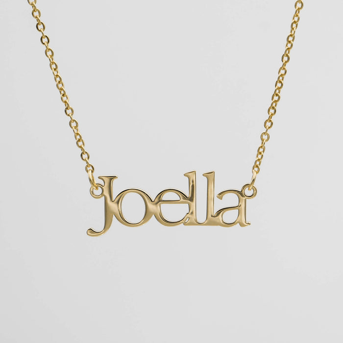 Gold necklace with "Joella" name pendant.