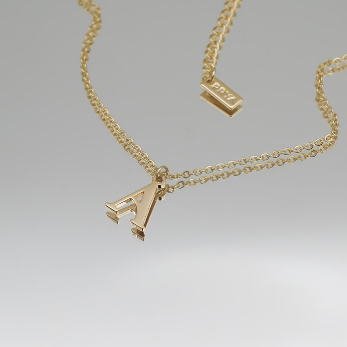 18k gold plated initial necklace featuring the letter "A" on a classic chain, perfect for personalized style.