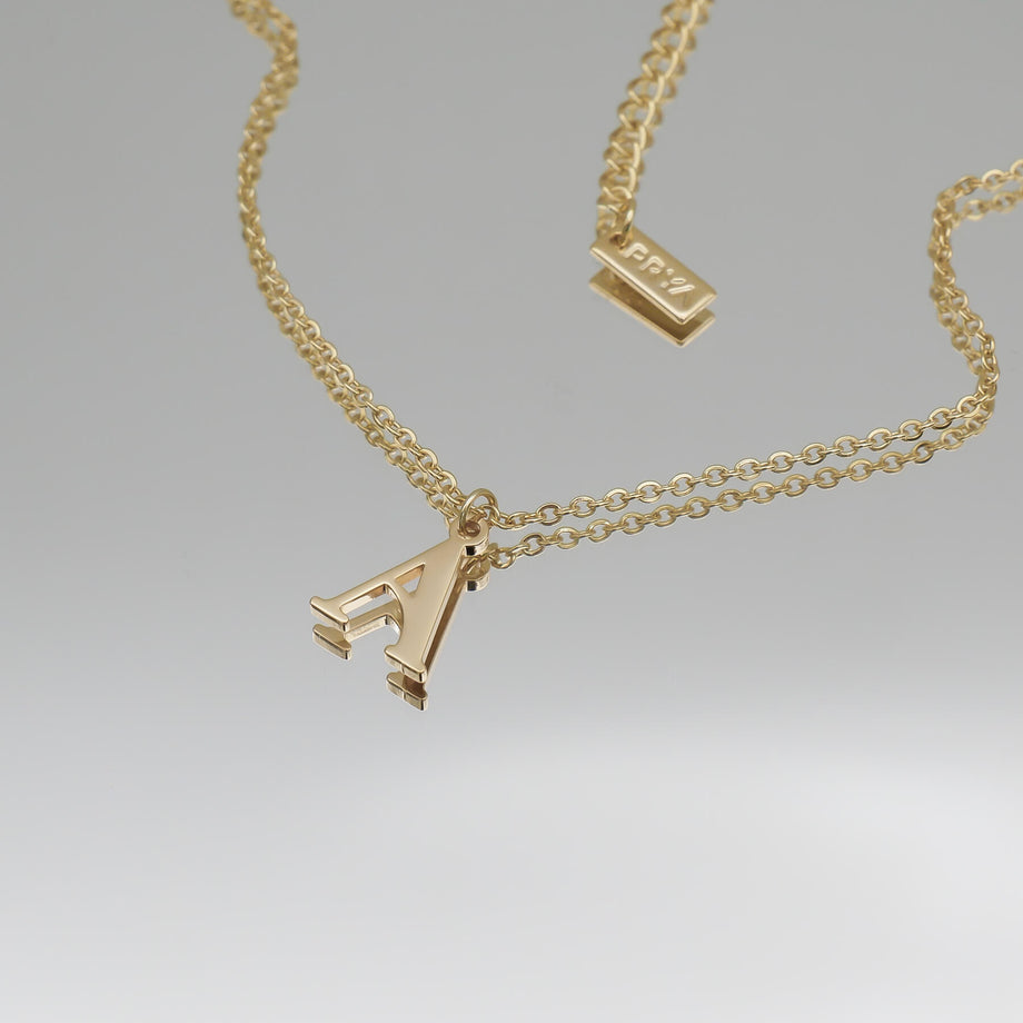 18k gold plated initial necklace featuring the letter "A" on a classic chain, perfect for personalized style.